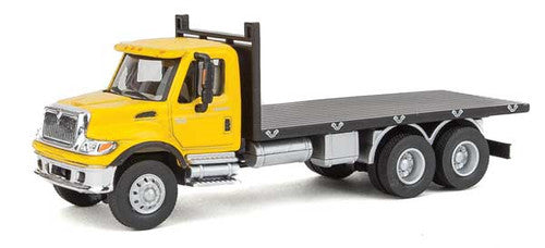 Walthers HO Scale SceneMaster Assembled International 7600 Three-Axle Flatbed Truck with Yellow Cab and Black Flatbed - Ideal for Model Railroad Enthusiasts
